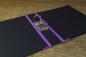 Preview: black folder open with lever mechanism and reinforced linen edges, lilac